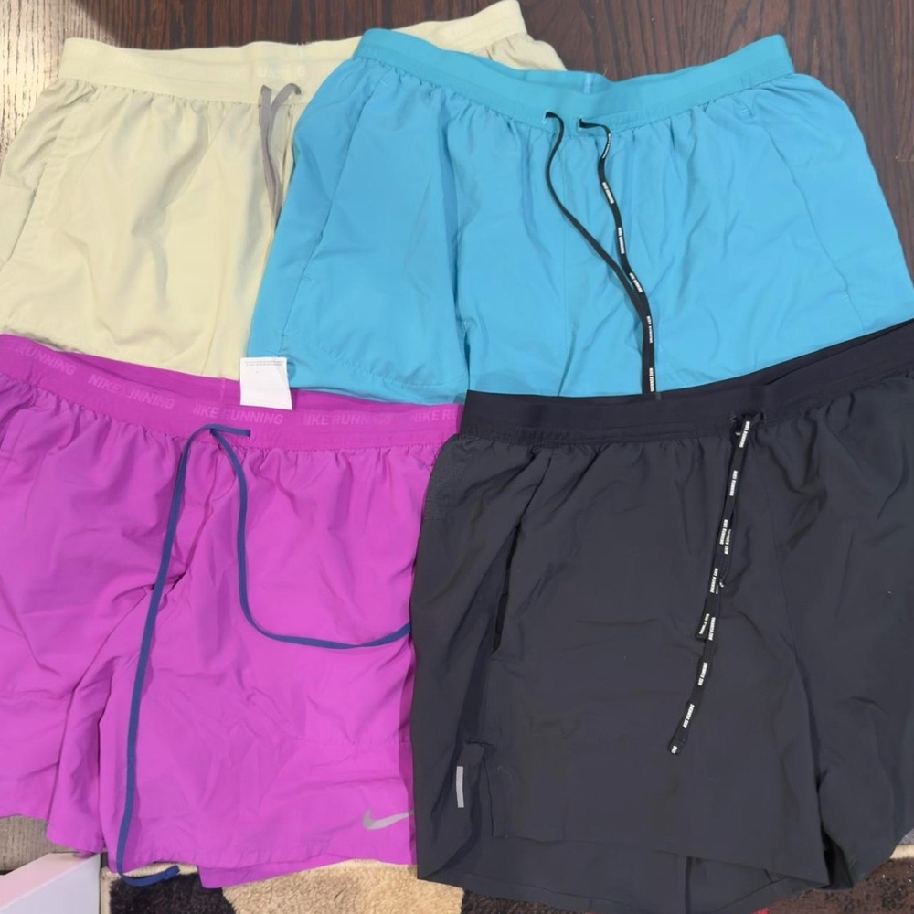 Nike Running shorts (4) - Men’s Large good condition.